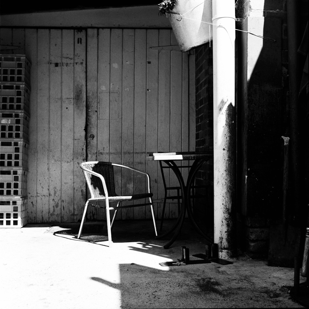 Industrial Urban Print, Makeshift break room with table, chairs, and milk crates in a cafe side ally, Bendigo, Victoria